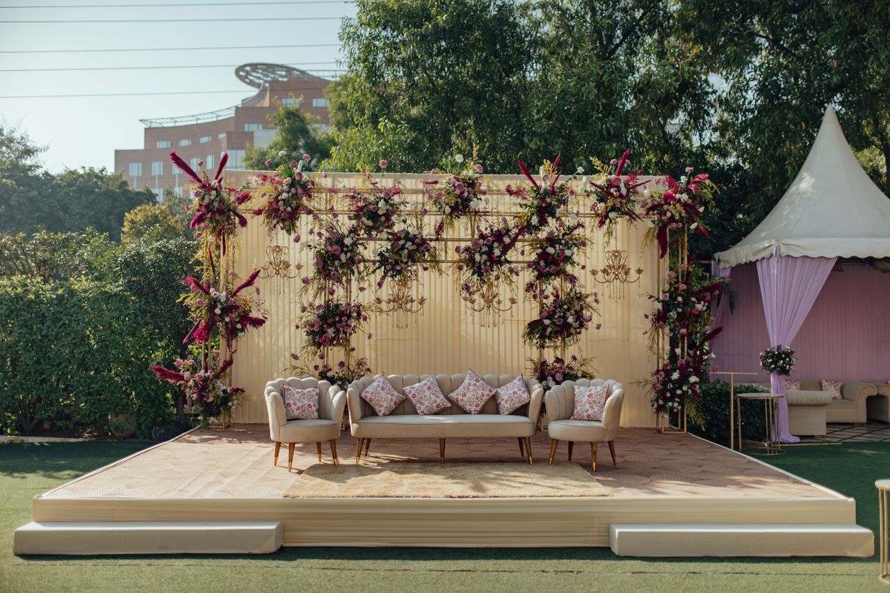 services-04 Beautifully decorated outdoor wedding seating area with lush floral arrangements and elegant furniture.