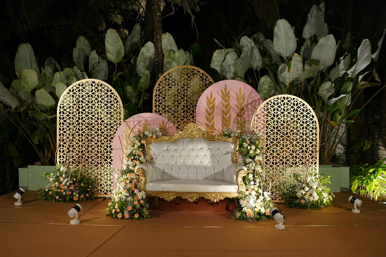 The Art of Drawing Readers In: Your attractive post title goes here Luxurious wedding stage with floral arrangements and ornate seat, perfect for ceremonies.