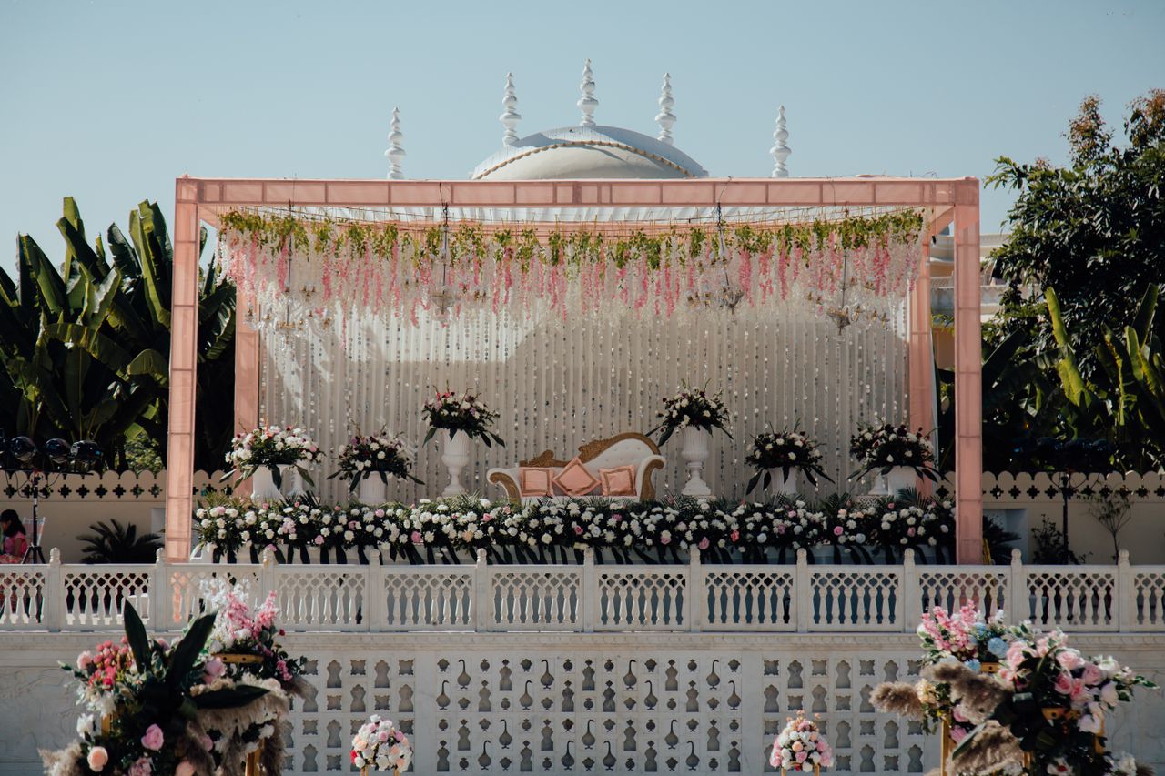 Mastering the First Impression: Your intriguing post title goes here Beautiful outdoor wedding stage adorned with floral arrangements and white decor, perfect for celebrations.